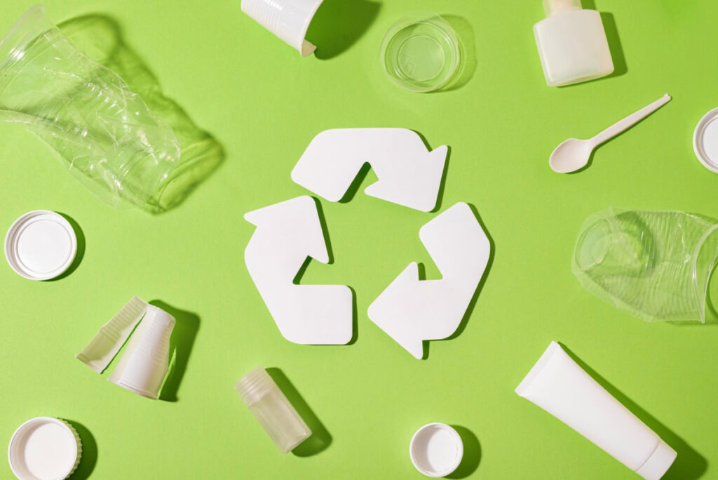 Recycling logo with plastic products