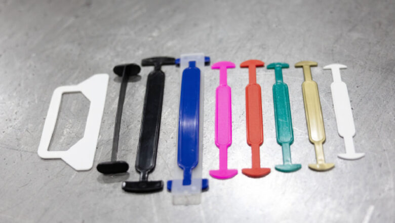 Coloured plastic carton carry handles