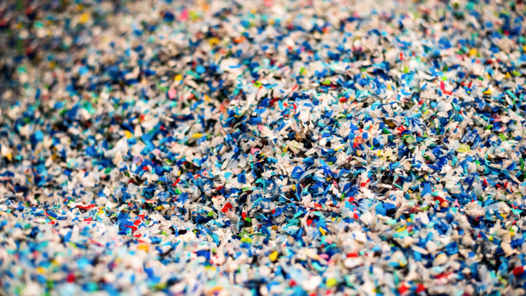 Shredded plastic waste material